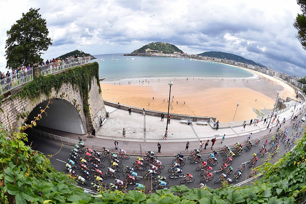 The peloton winds its way along the coastline in San Sebastian