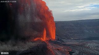 A photograph of Kilauea volcano erupting with a gigantic fountain of lava.