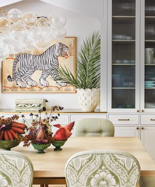 dining area in kitchen with tiger artwork on walls