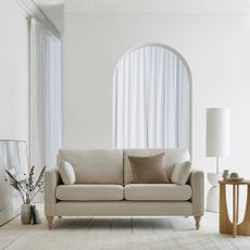 white sofa in white room 