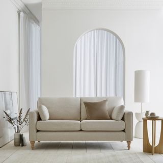 white sofa in white room