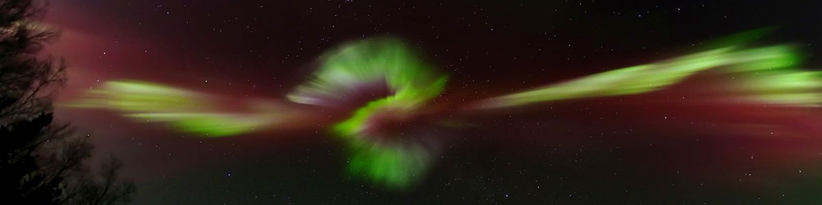 Green Aurora Shimmers Over Alaska by LeRoy Zimmerman