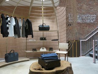 The bare bricked ground floor's event space is currently occupied by a Louis Vuitton pop-up shop