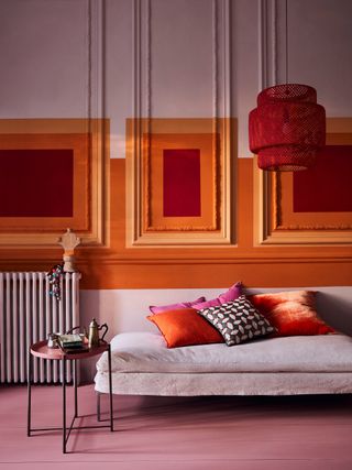 modern paint design on traditional wall panelling in living room