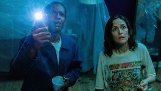Linda (Rose Byrne) look at the damage in her apartment with James (ASAP Rocky) in If I Had Legs I'd Kick You.