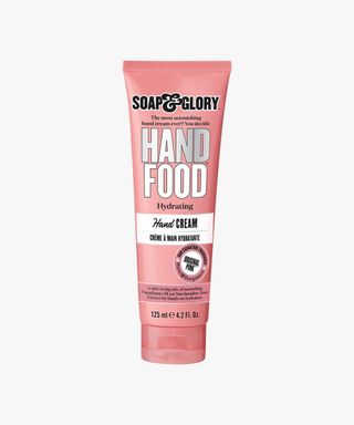 An image of Soap & Glory's hand cream. The picture is of a pink tube depicting the name Hand Food.