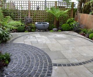 two circular patios laid in contrasting materials