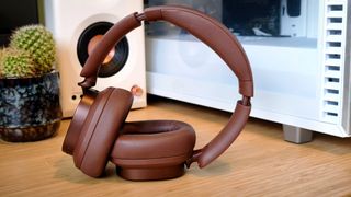 Brown Edifier ES850NB headphones on a desk