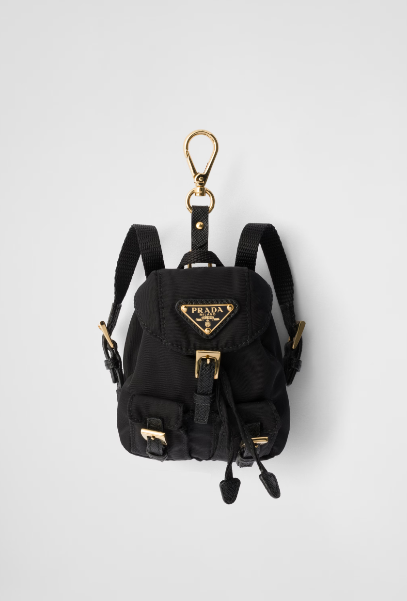 An image of a Prada bag charm of one of the most popular designer handbags.