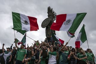 Mexico soccer fans celebrate big at the Cuauhtemoc monument in Tijuana, Baja California state, after a win against Germany in their first match of the 2018 World Cup.