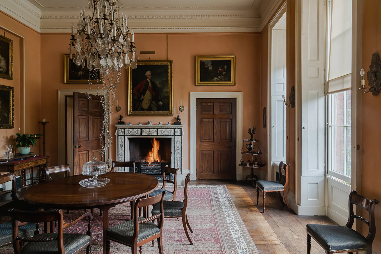 ornate living room with orange walls