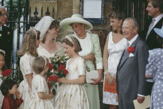 Diana, Princess of Wales (1961 - 1997) and her friend Carolyn Bartholomew at the wedding of Diana's former flatmate Virginia Pitman (left) to Henry Clarke at Christ Church in Chelsea, London, 30th August 1991