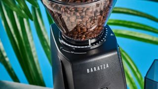 the baratza encore esp coffee grinder with a 200g capacity hopper, steel burr, with plastic black exterior