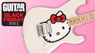 A white Squier Hello Kitty Stratocaster body on a pink background