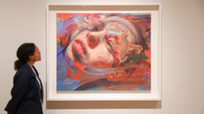 A visitor views a painting by Jenny Saville, on display as part of her solo exhibition 'The Anatomy of Painting' at the National Portrait Gallery.