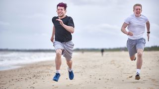 two runners on a beach