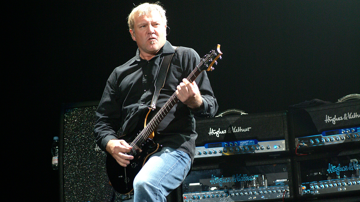 Alex Lifeson performing live onstage, with Hughes & Kettner amplifiers behind