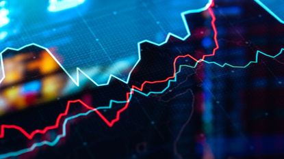 closeup of stock market chart with teal, red and green moving averages