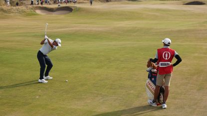 Collin Morikawa at the top of his backswing