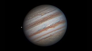 A close-up of Jupiter and one of its orbiting satellites taken by Peter Richardson