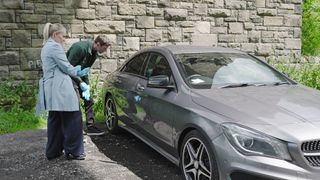 DS Lisa Swain and Kit Green examine a silver car in Coronation Street.