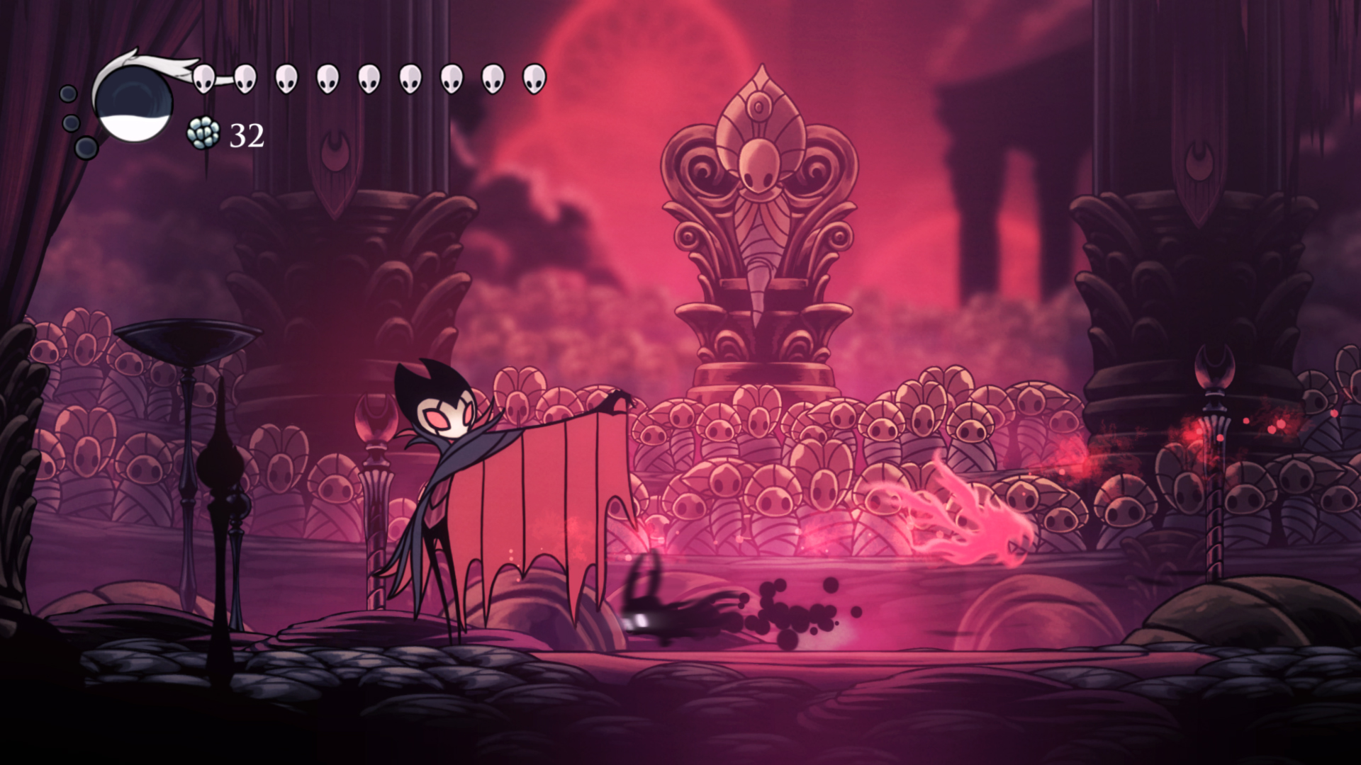 The shaded knight fights Grimm in Hollow Knight