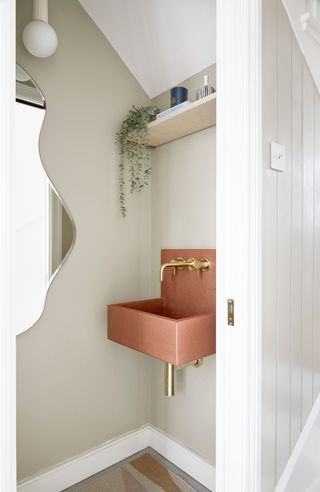 Small downstairs bathroom with pink sink