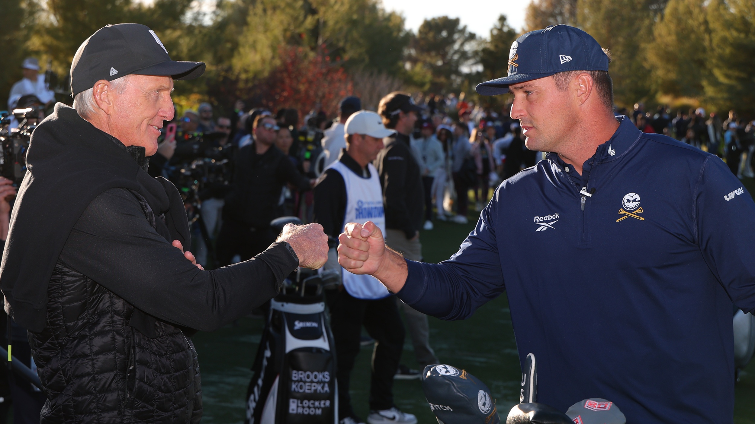 Greg Norman and Bryson DeChambeau give each other a fist pump during match-up event between LIV Golf and PGA Tour