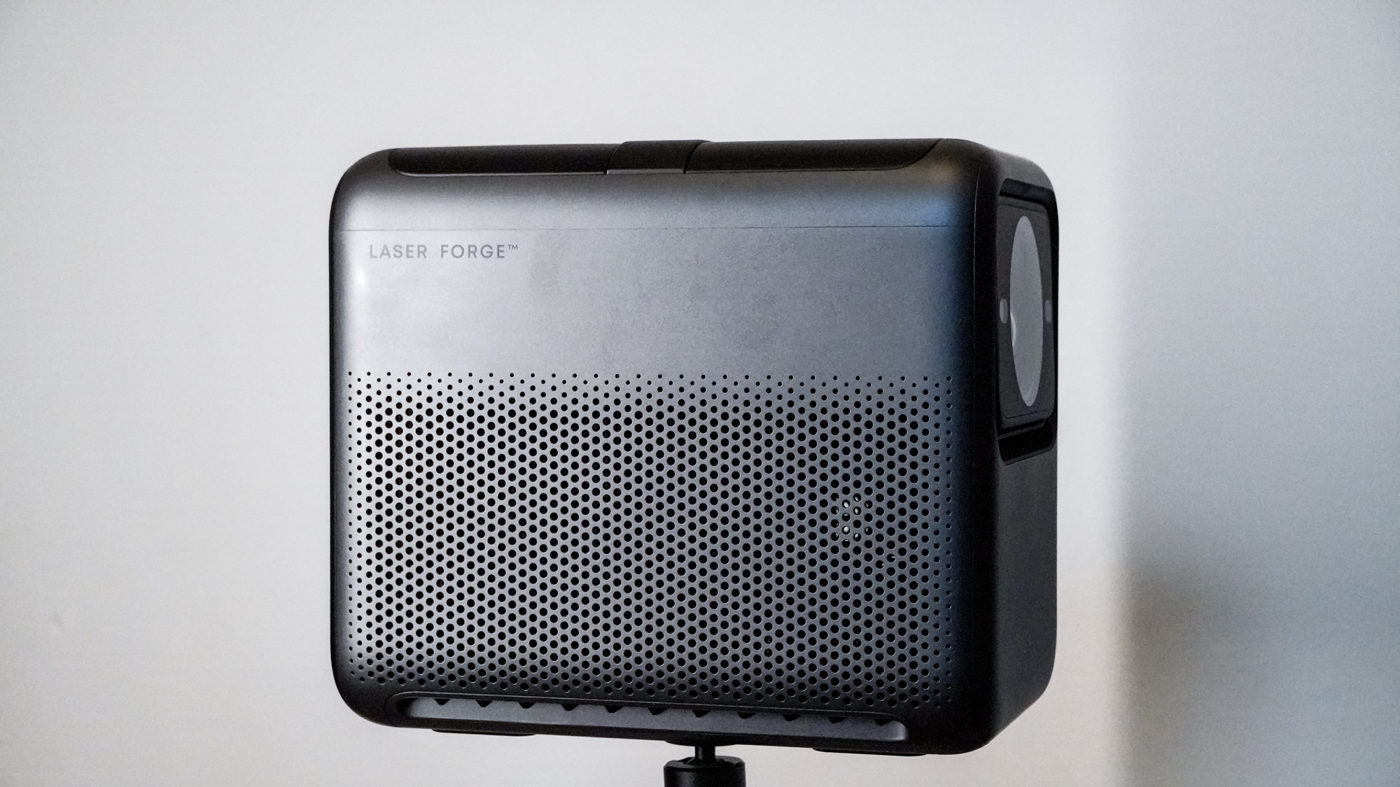 A side view of an Anker Nebula X1 projector with the handle stowed.