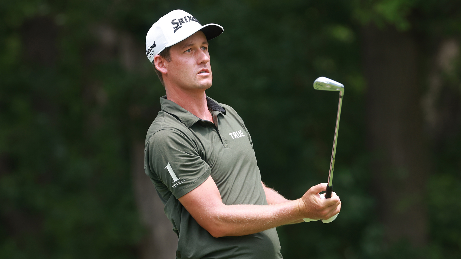 Andrew Putnam hits an iron shot and watches its flight