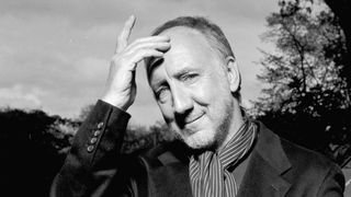 Pete Townshend scratching his forehead