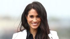 Meghan, Duchess of Sussex smiles during the JLR Drive Day at Cockatoo Island on October 20, 2018