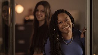 Jazz Raycole as Izzy smiling in The Lincoln Lawyer season 2