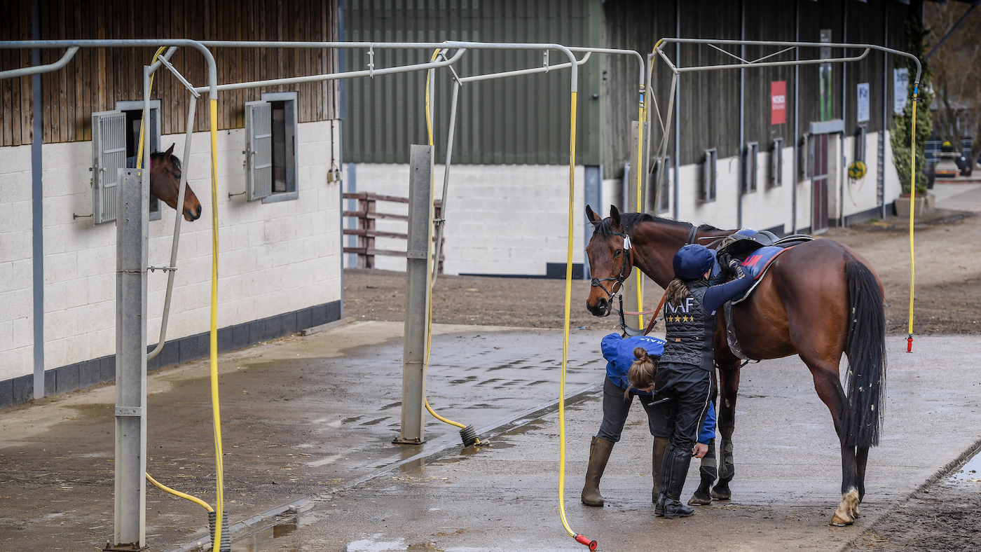Laura Collett being legged up on a racehorse