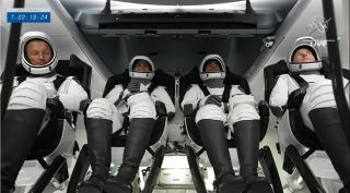 SpaceX's Crew-3 astronauts are seen inside their Crew Dragon Endurance ahead of a planned launch from NASA's Kennedy Space Center Pad 39A on Nov. 10, 2021.