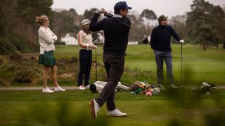 Golfers wearing Heathlander golf shoes and knitwear