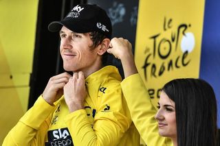 Geraint Thomas (Team Sky) puts on the yellow jersey after stage 20 at the Tour de France