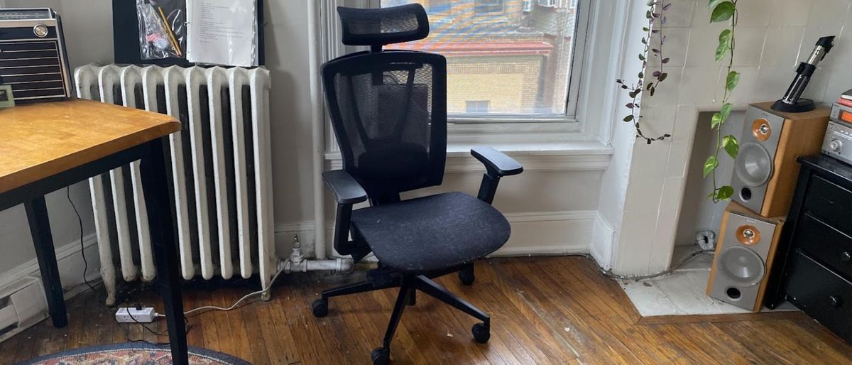 Autonomous ErgoChair Mesh next to a window in a living room