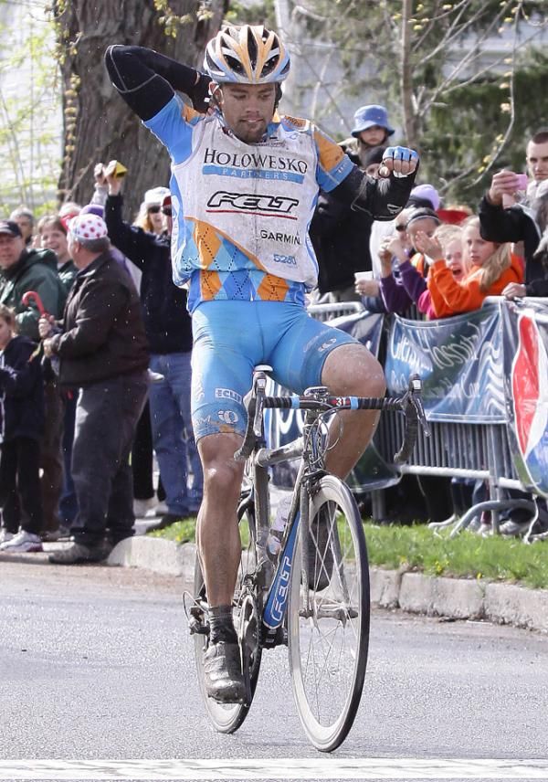 Zipping up for the cameras: Caleb Fairly (Holowesko Partners) crosses the finish line in first place and arrives at the biggest win of his career.