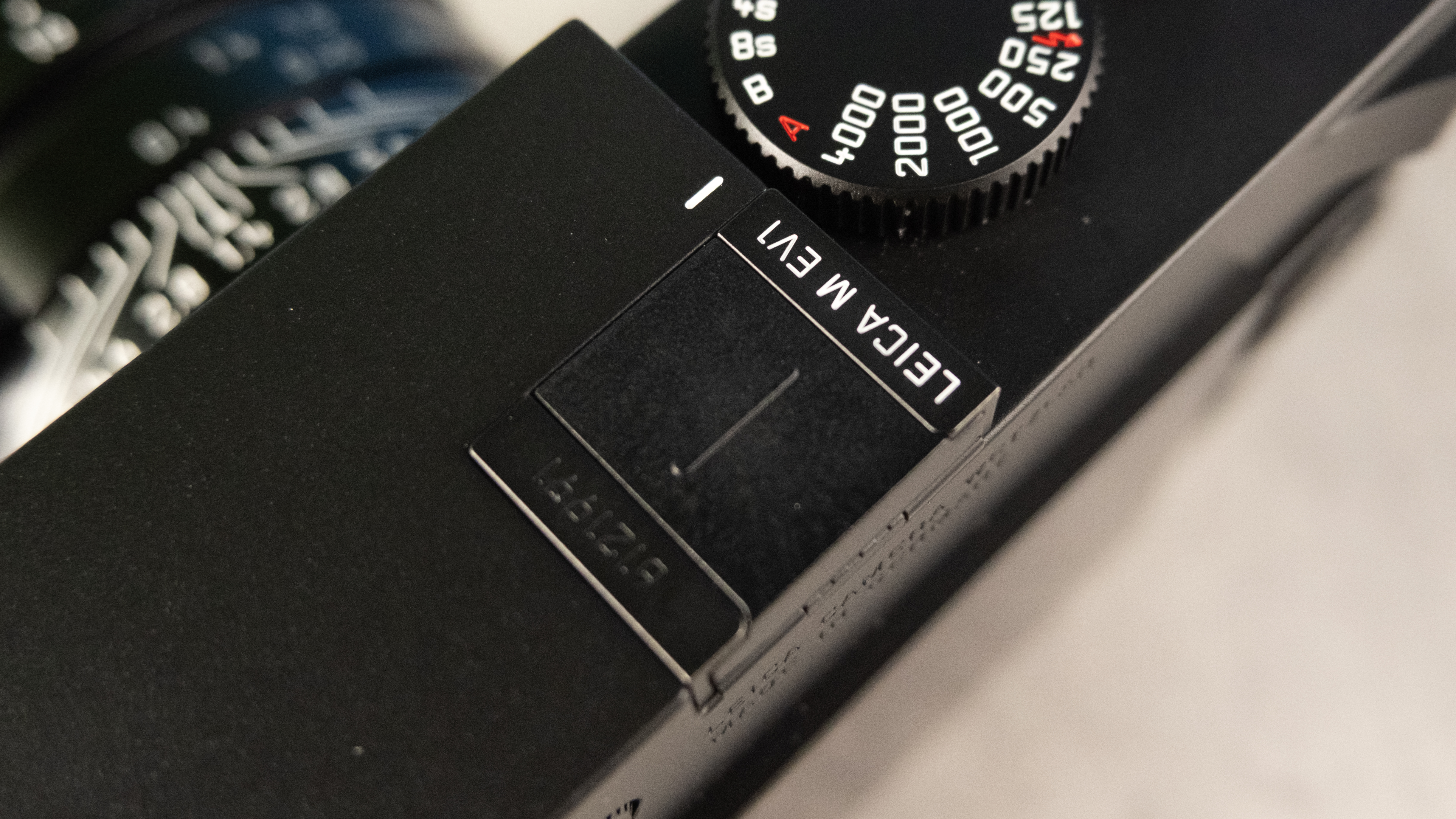 A black Leica M EV1 rangefinder-style camera