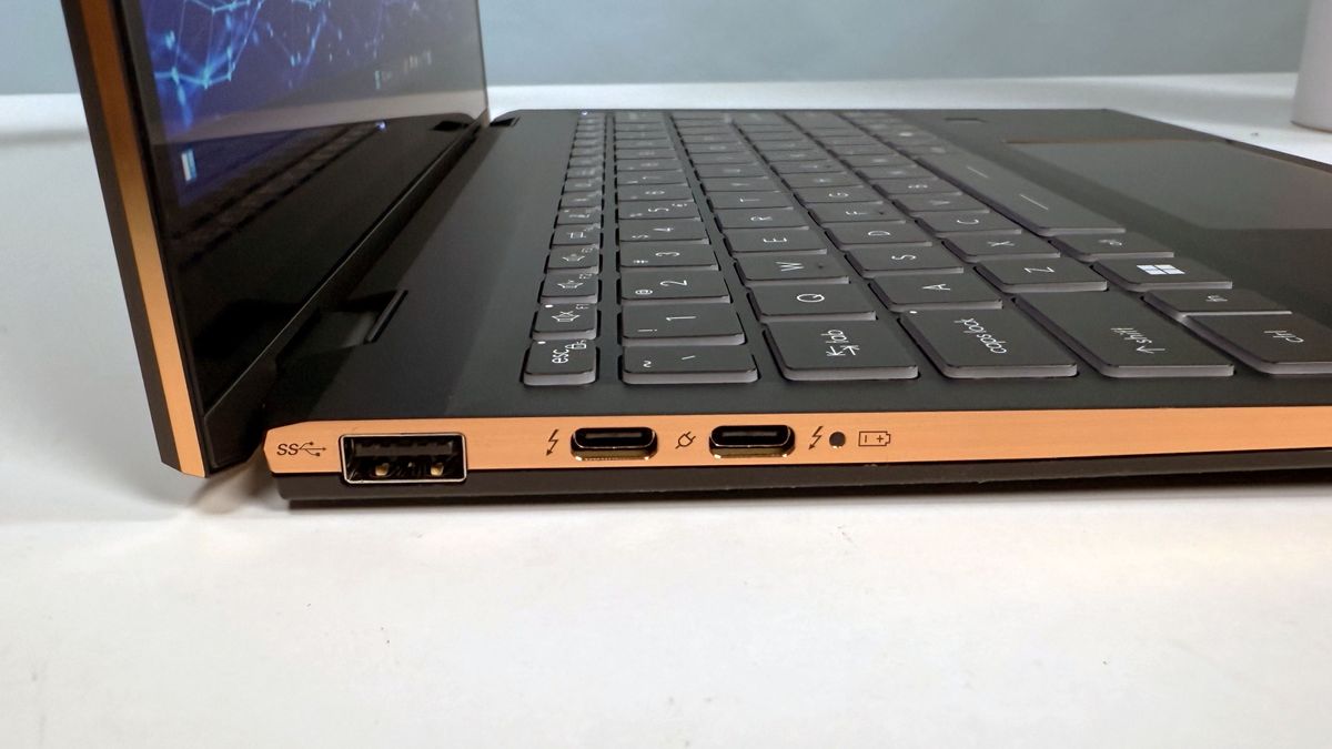 Sideview of MSI Summit 13 AI+ Evo (A2VM) 2-in-1 laptop open in clamshell mode on a white table to show ports on left side