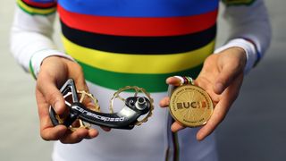 Tom Pidcock has been presented with a 24-carat gold plated CeramicSpeed OSPW system,