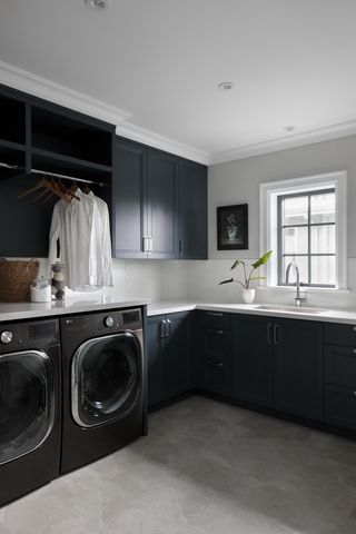 A laundry room with hanging space