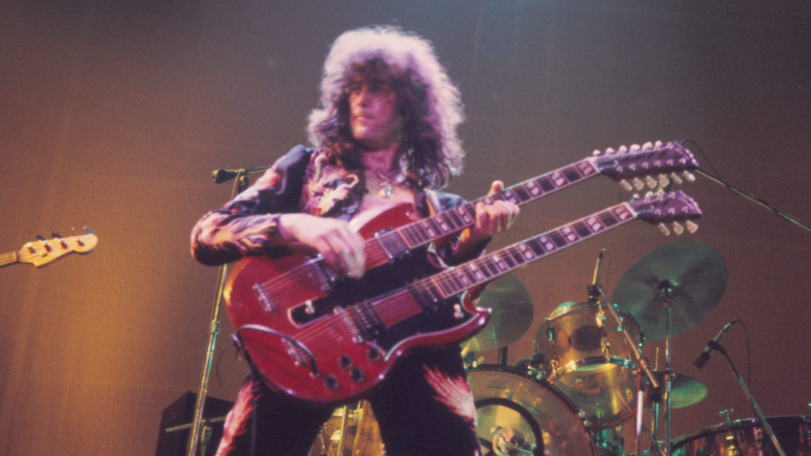 Jimmy Page is playing a Gibson EDS-1275 double necked guitar.
