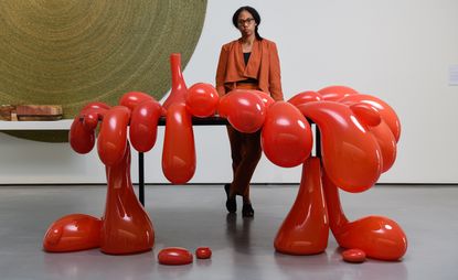 For the Hepworth Wakefield’s ’Anthea Hamilton Reimagines Kettle’s Yard’, the Turner Prize-nominee (pictured here with her Vulcano Table, 2014) mixes 20th century art and decorative objects with a series of new works. Photography: Darren O’Brien/Guzelian. Courtesy Hepworth Wakefield