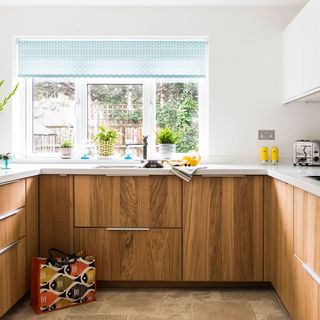 kitchen with u shape and wooden kitchen trolley