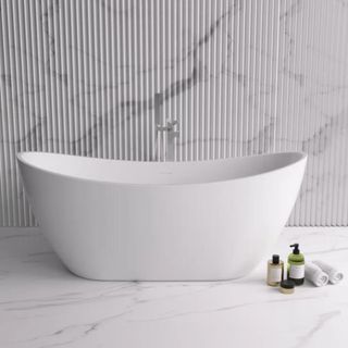 A freestanding white bathtub