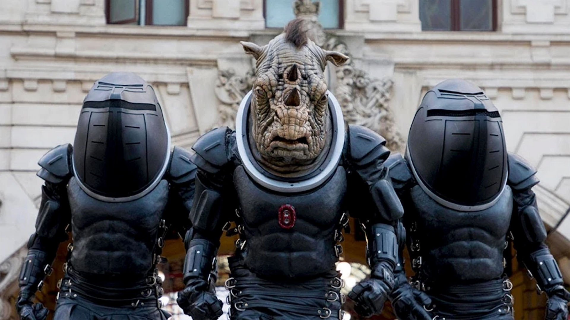 Three Judoon in front of a building on Earth