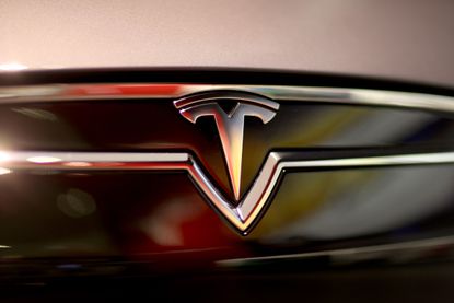 A Tesla logo on a vehicle