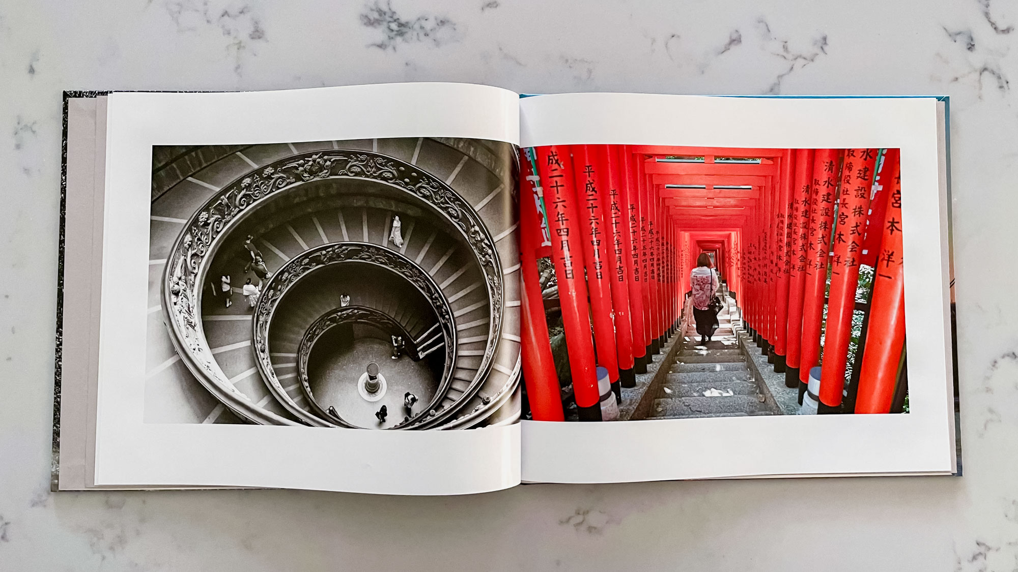 A Blurb photo book open on a countertop surface
